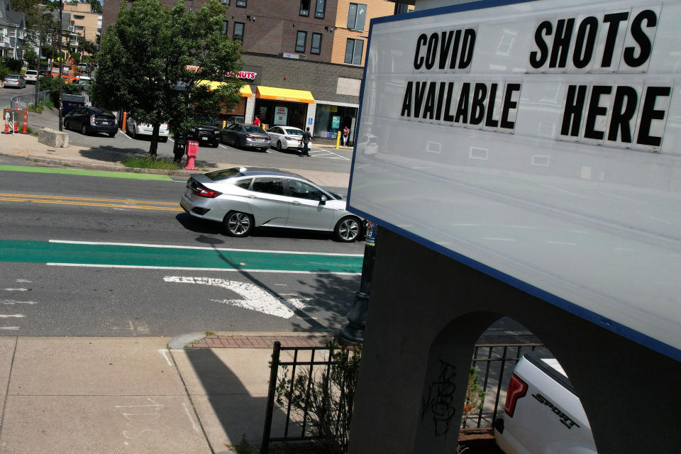 A sign advertises COVID-19 vaccine shots at a Walgreens pharmacy in Somerville, Mass., in August. 