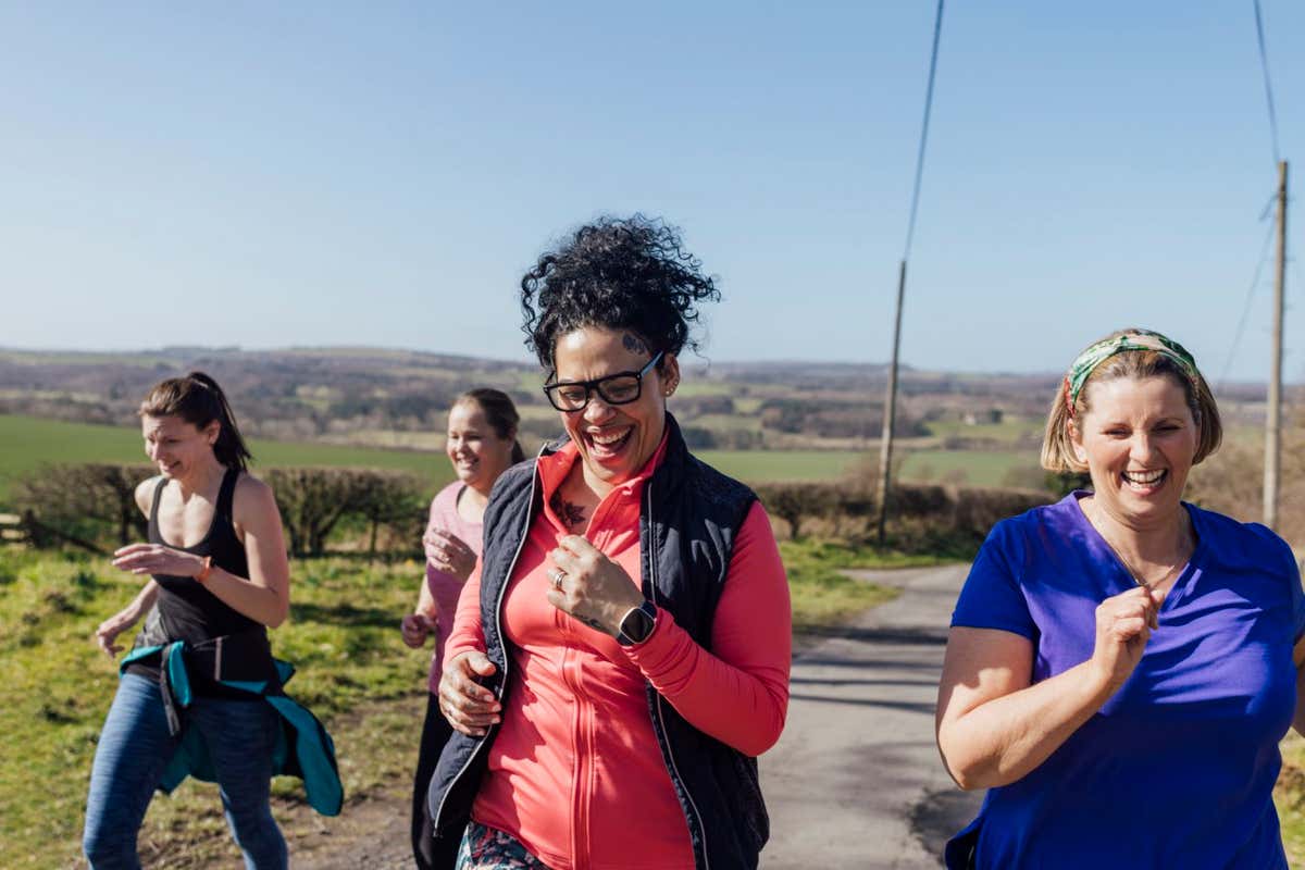 A group of women jogging uphill in County Durham, UK