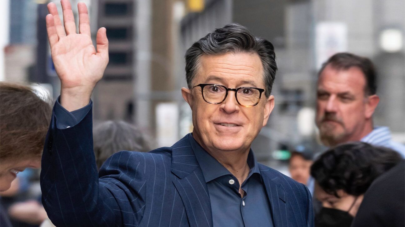 Late-night host Stephen Colbert is seen waving.